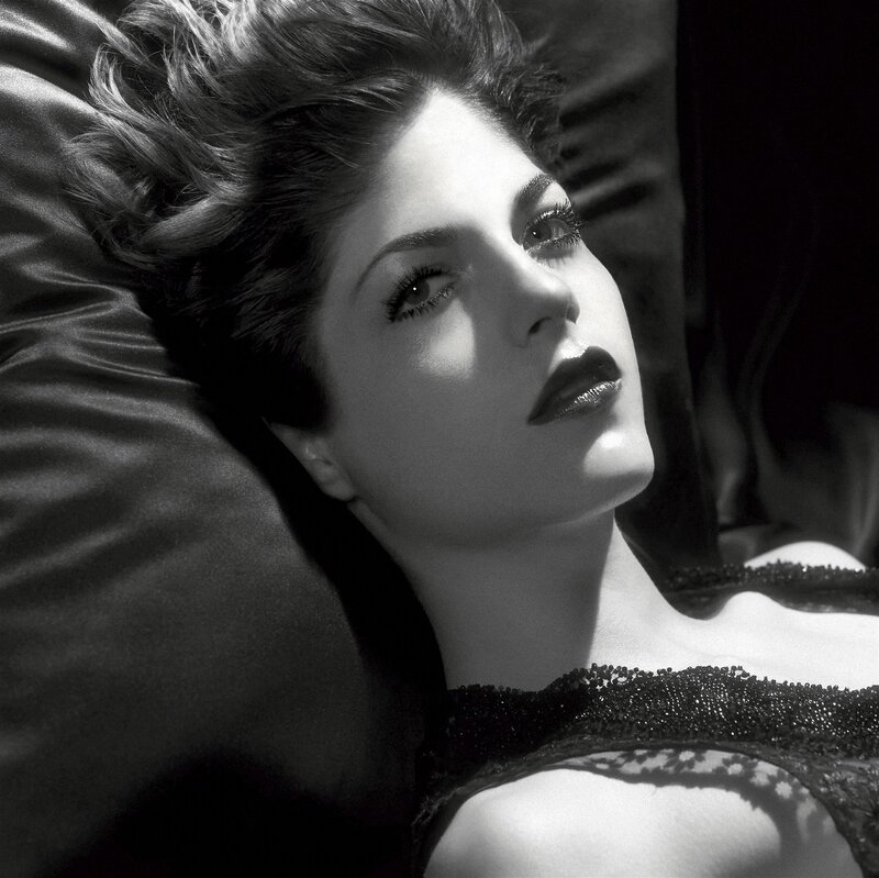woman lying on a pillow