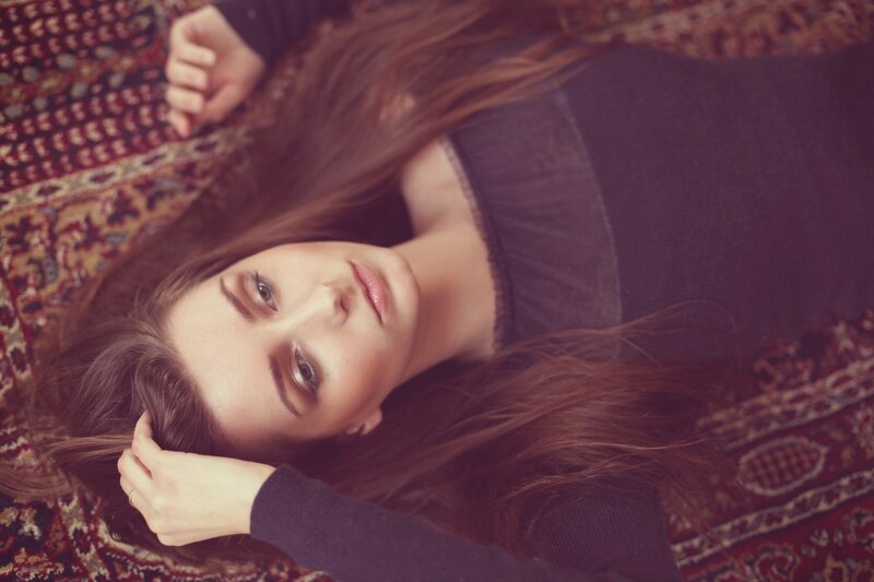 woman lying on a rug