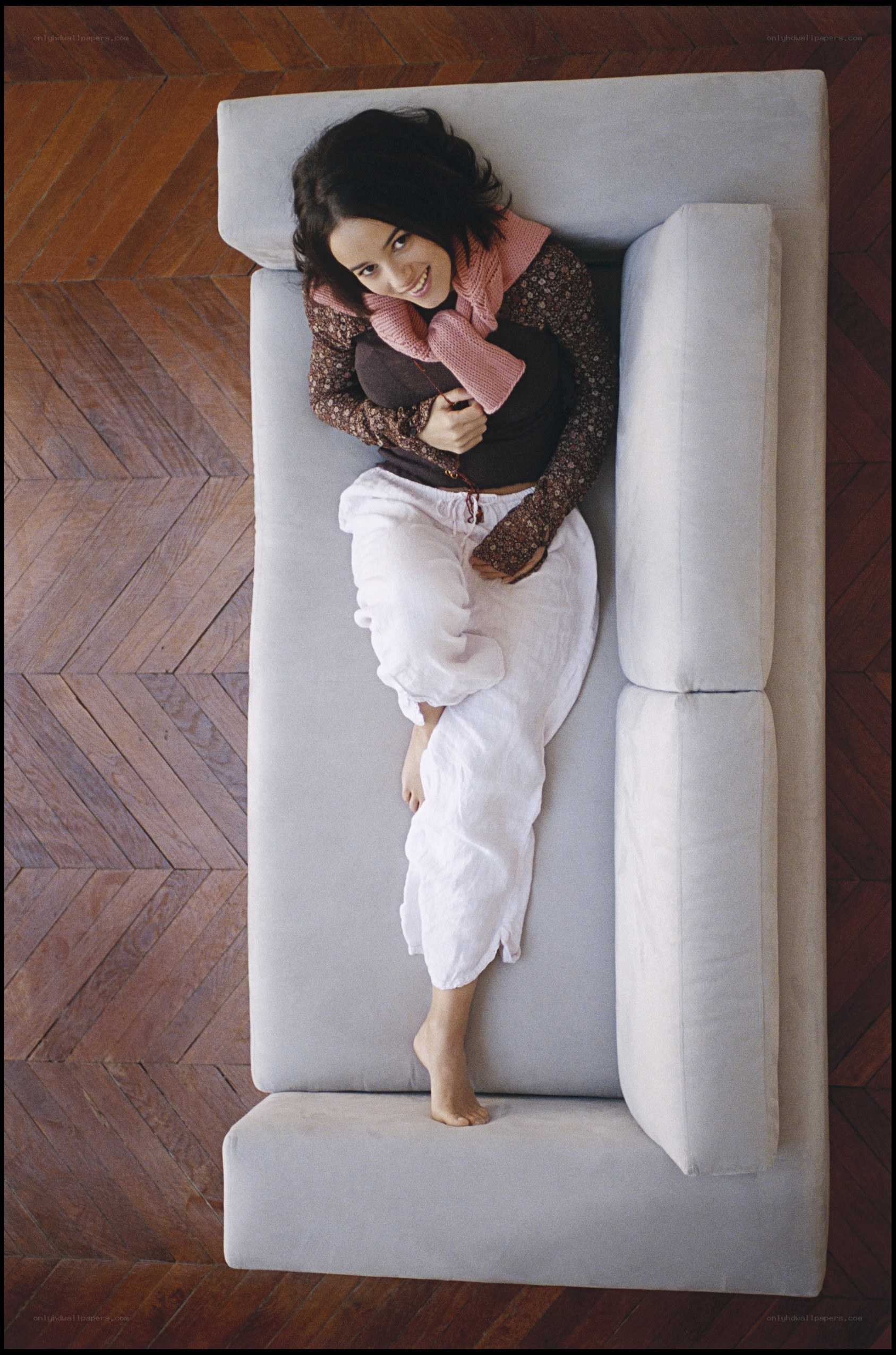 woman lying on a sofa