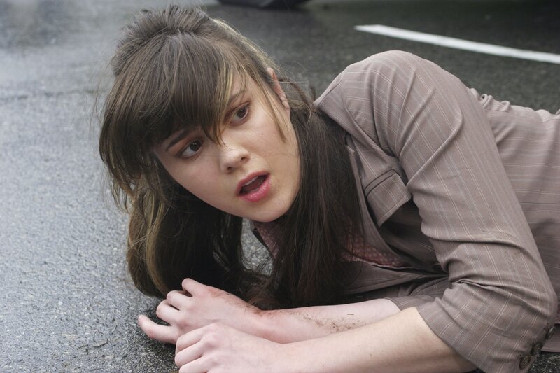 Woman Lying on Asphalt — Brown, Dramatic
