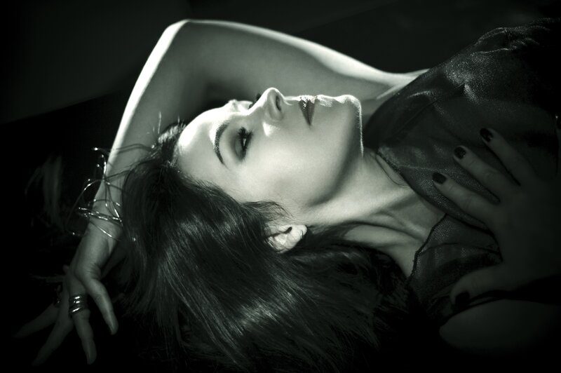 woman lying on back in black and white
