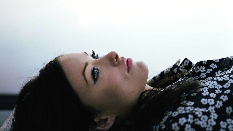 woman lying on back looking up