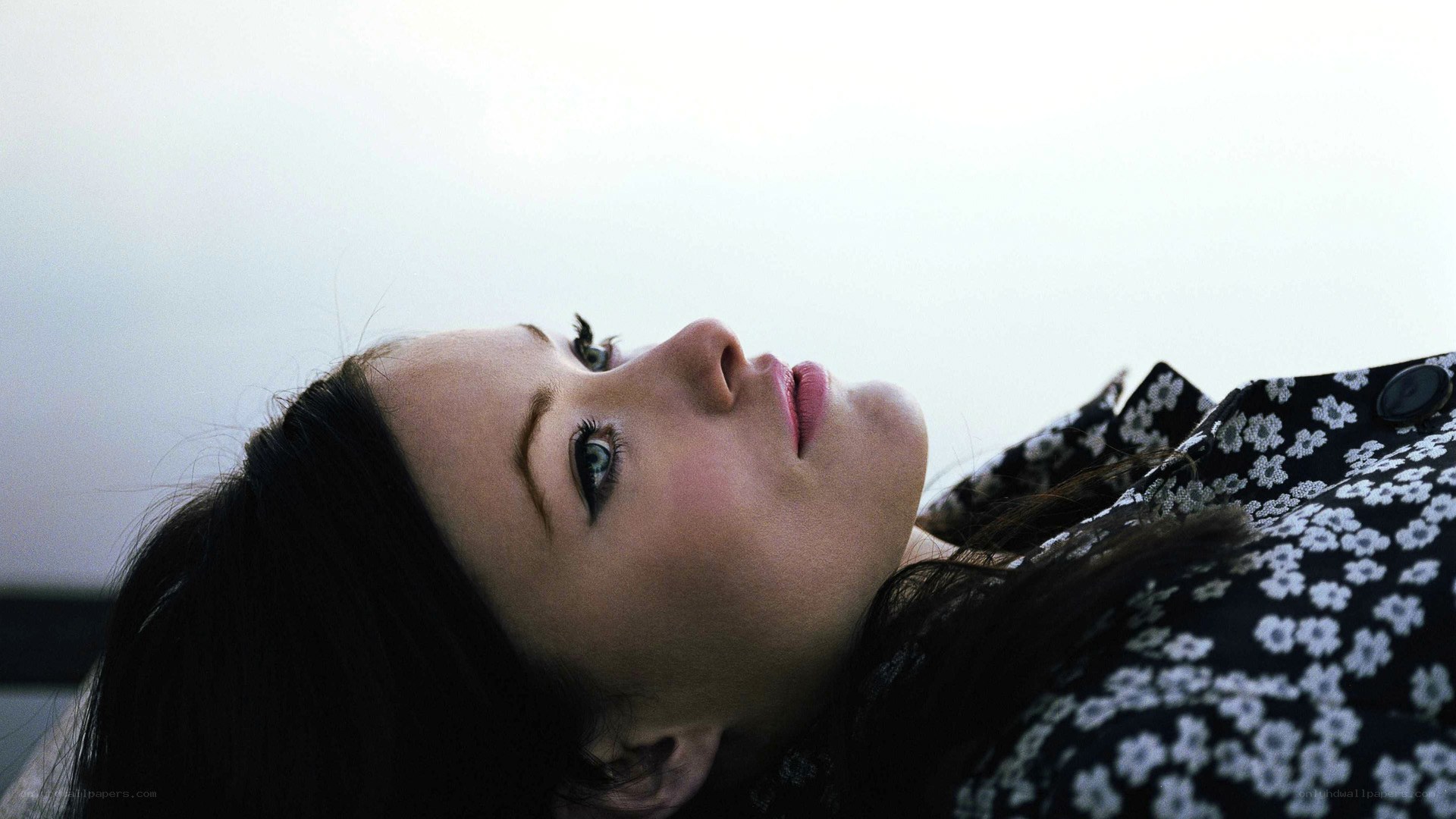 woman lying on back looking up