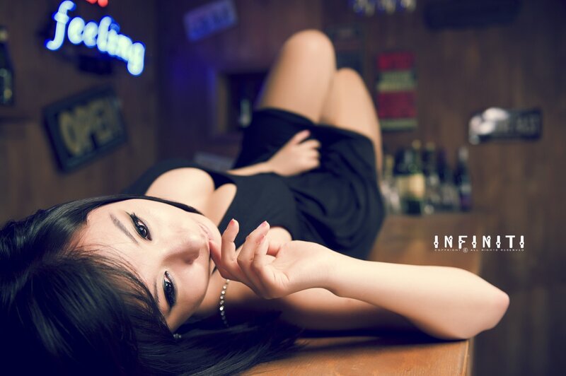 Woman Lying on Bar Counter — Black, Seductive, Night
