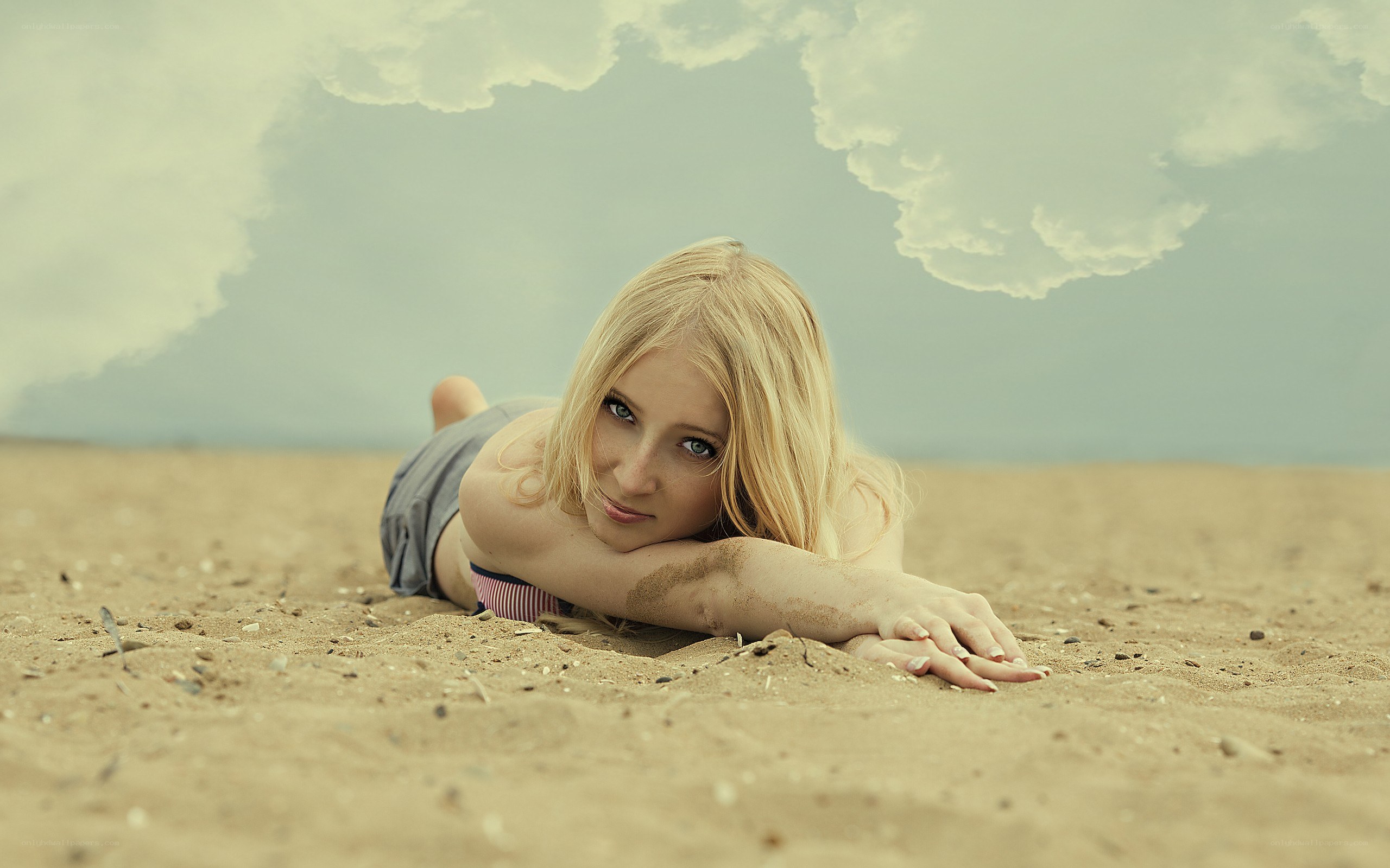 woman lying on beach