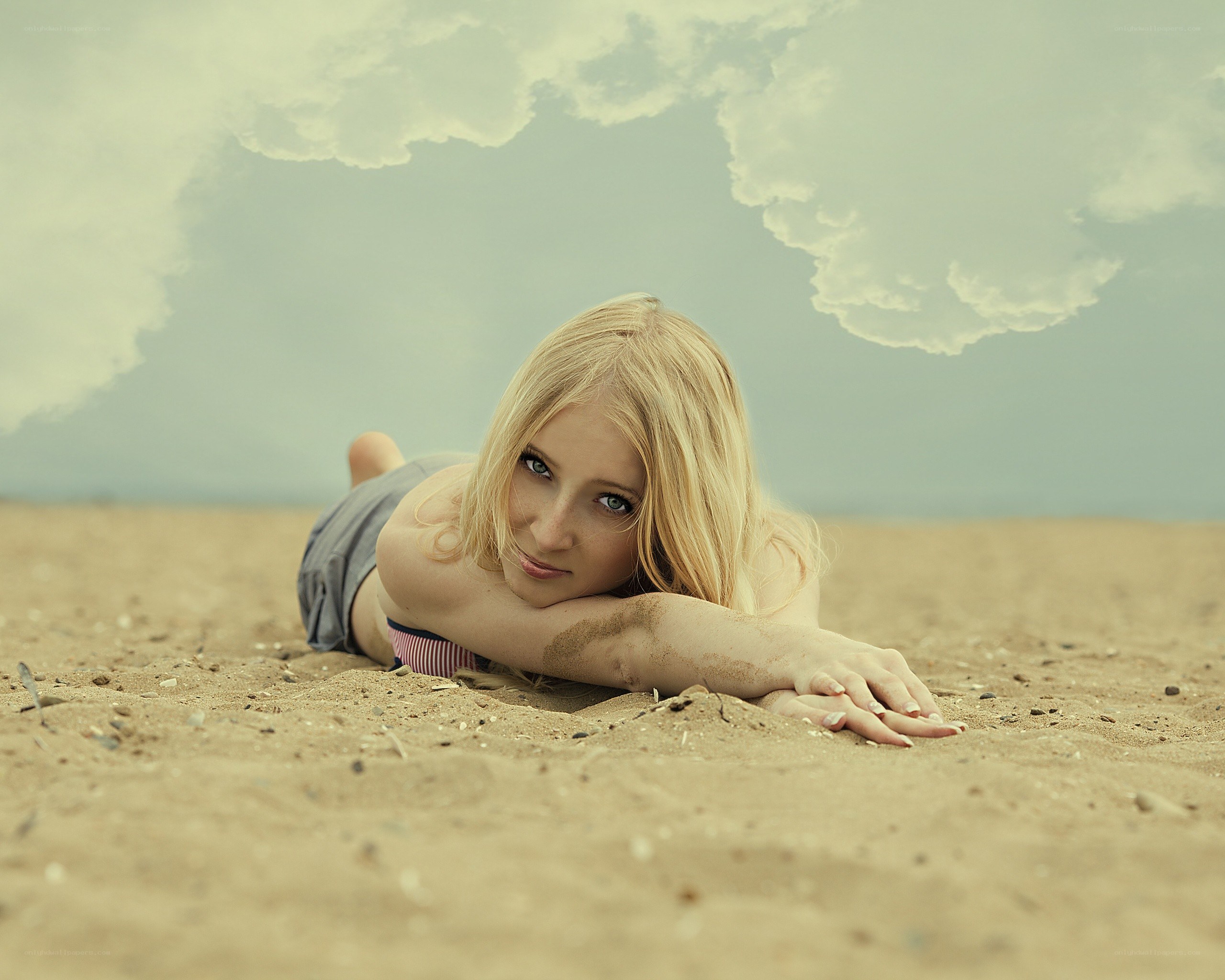 woman lying on beach