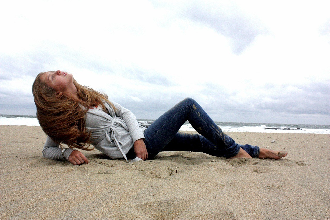 Woman lying on beach