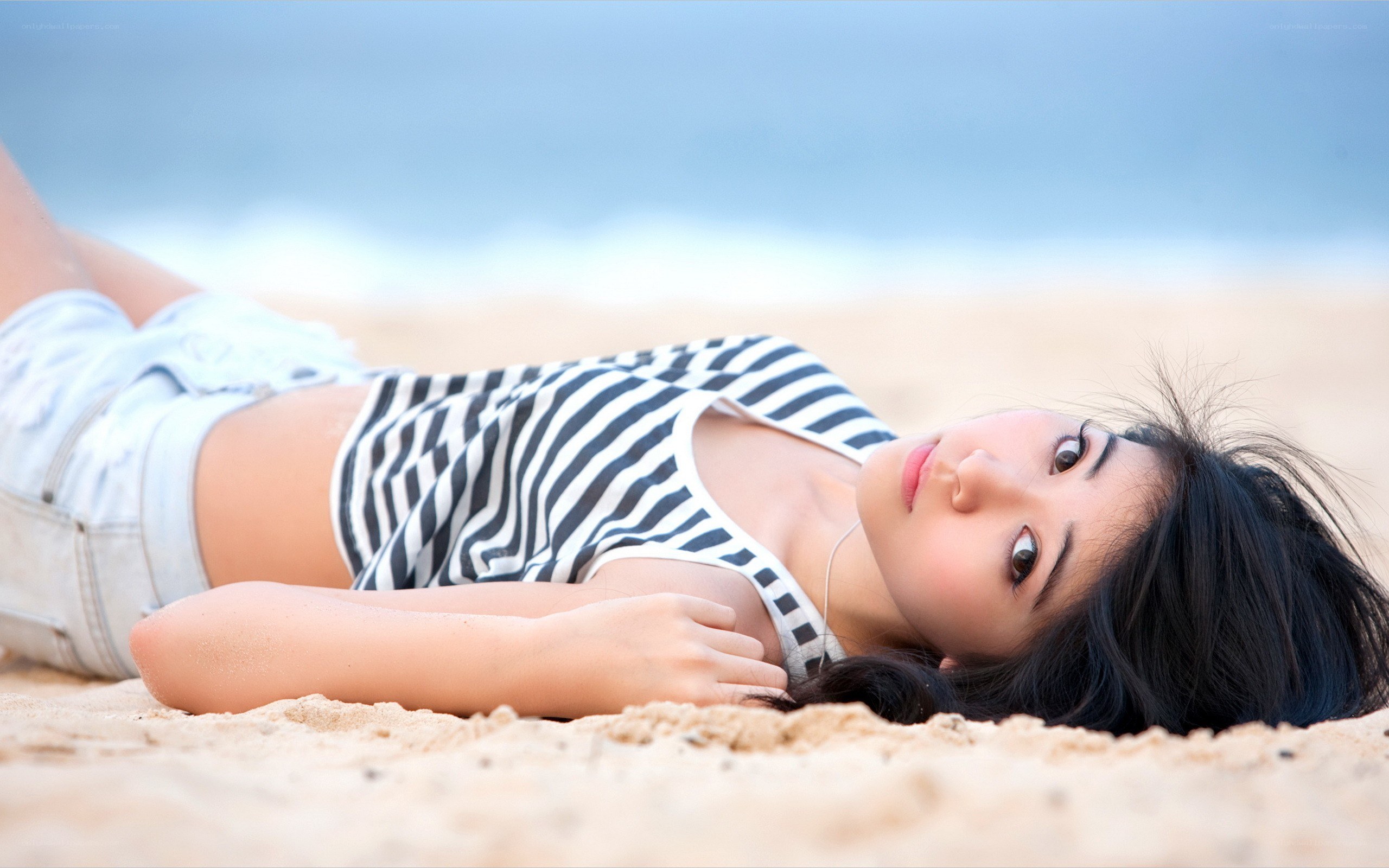 Woman lying on beach