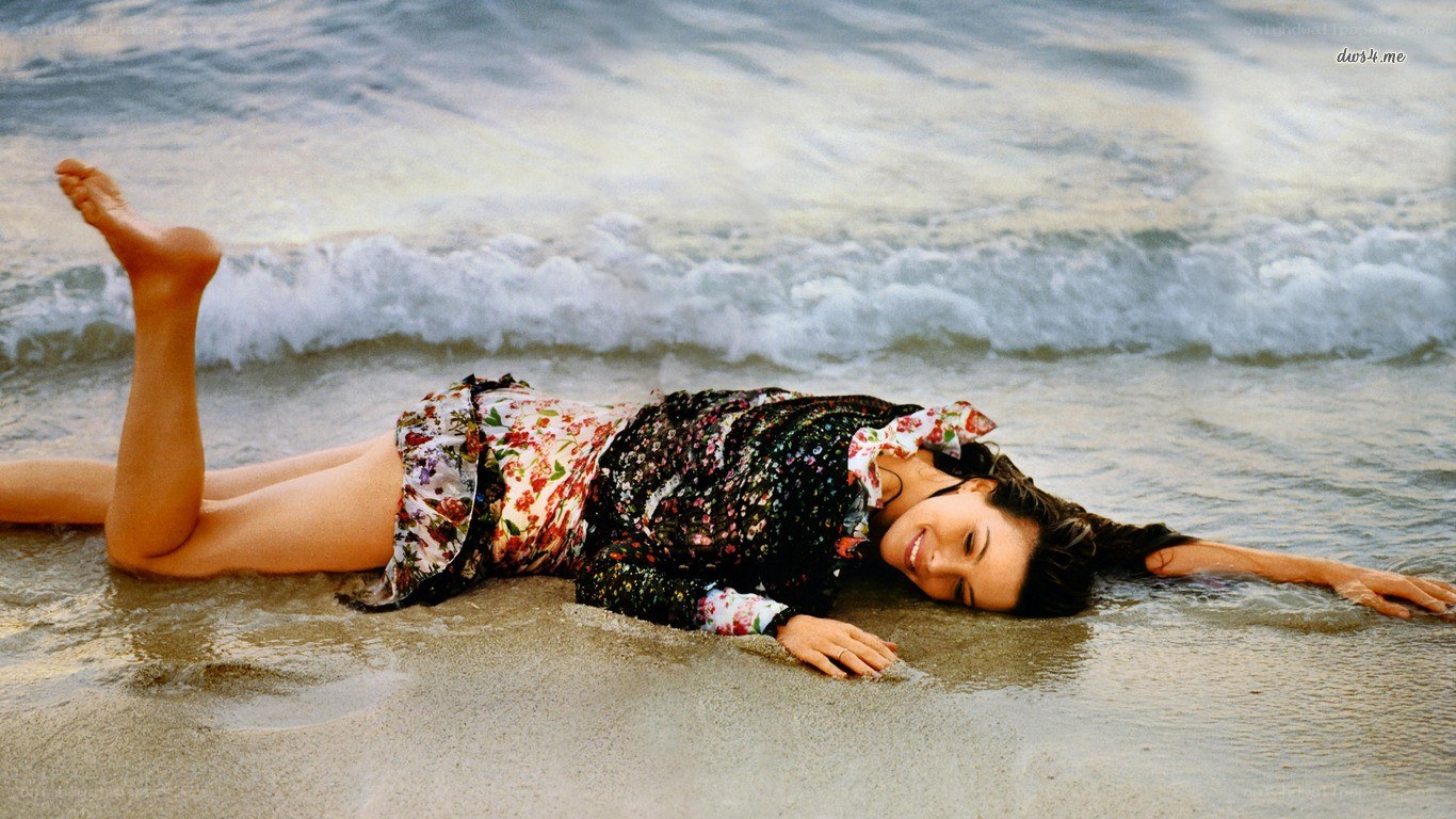 Woman lying on beach