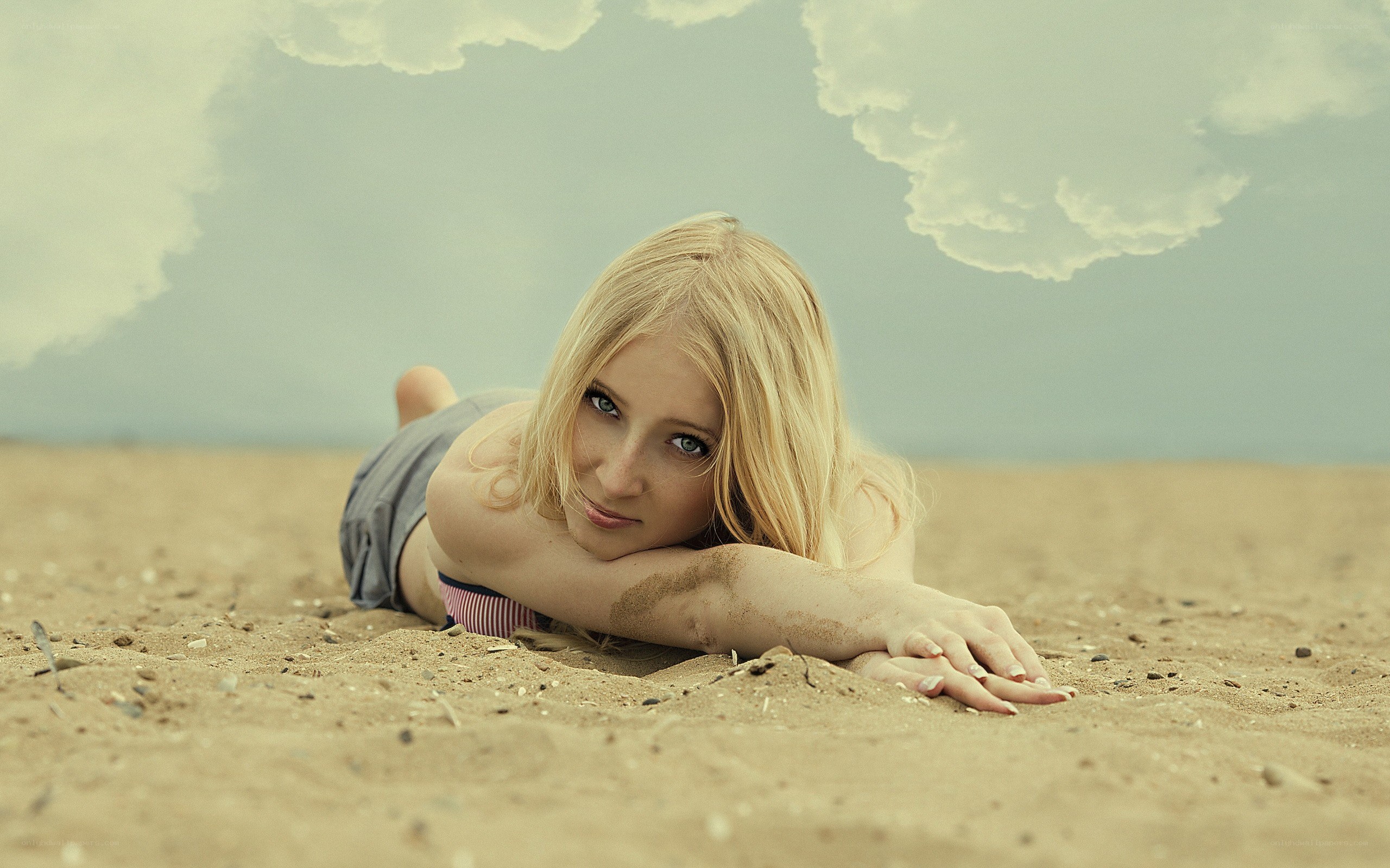 woman lying on beach
