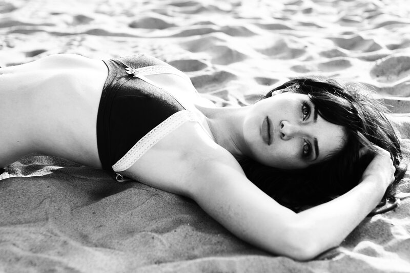 Woman Lying on Beach — Black