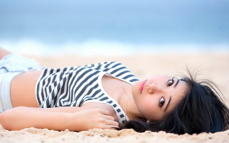 Woman Lying on Beach — Blue, Serene, Afternoon