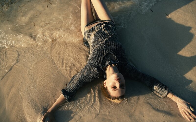 Woman Lying on Beach — Brown, Serene, Sunset, Photograph, Sand, Ocean, Waves