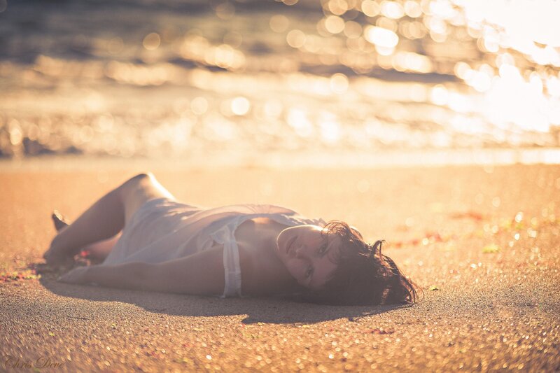Woman Lying on Beach — Gold, Serene, Sunset, Photograph