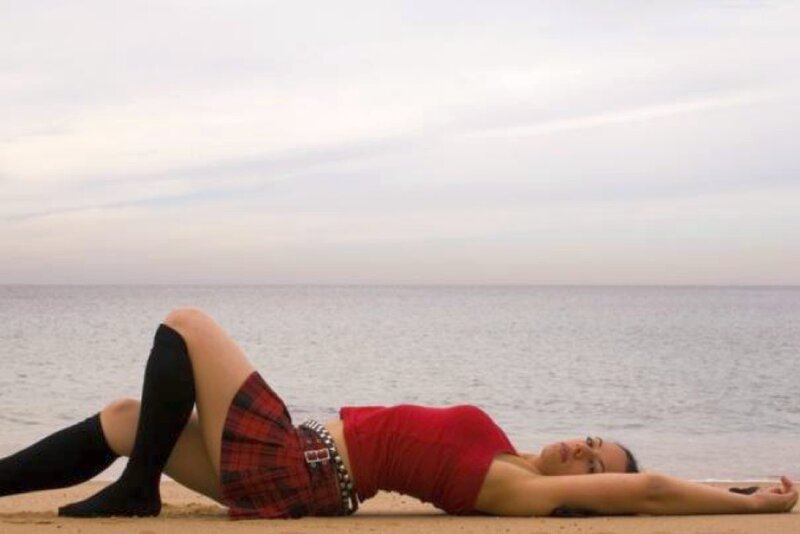 Woman Lying on Beach — Red