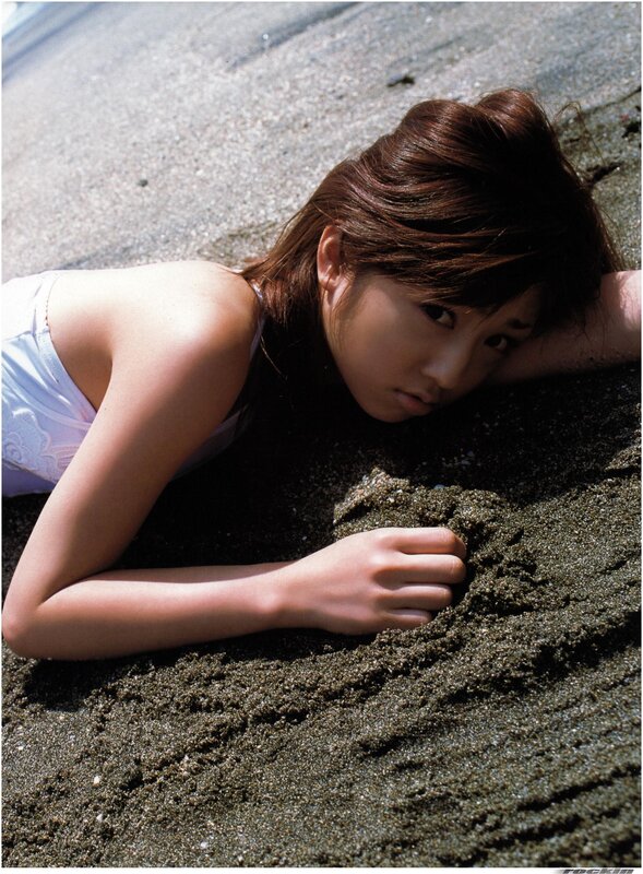 woman lying on beach sand