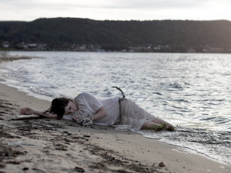 Woman Lying on Beach — White, Dramatic, Sunset, Photograph