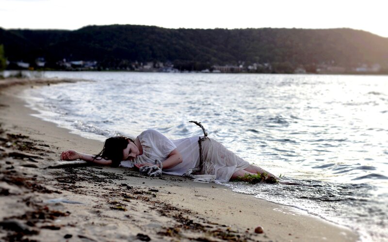 Woman Lying on Beach — White, Dramatic, Sunset