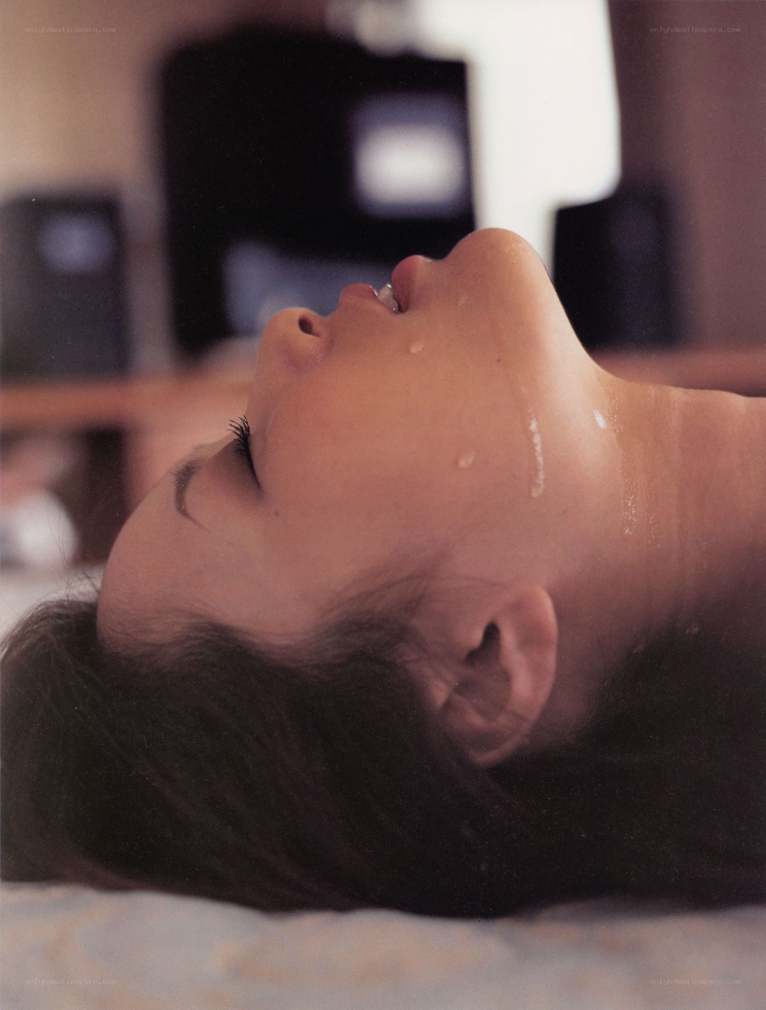 woman lying on bed