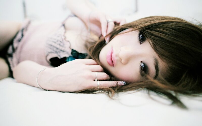 woman lying on bed
