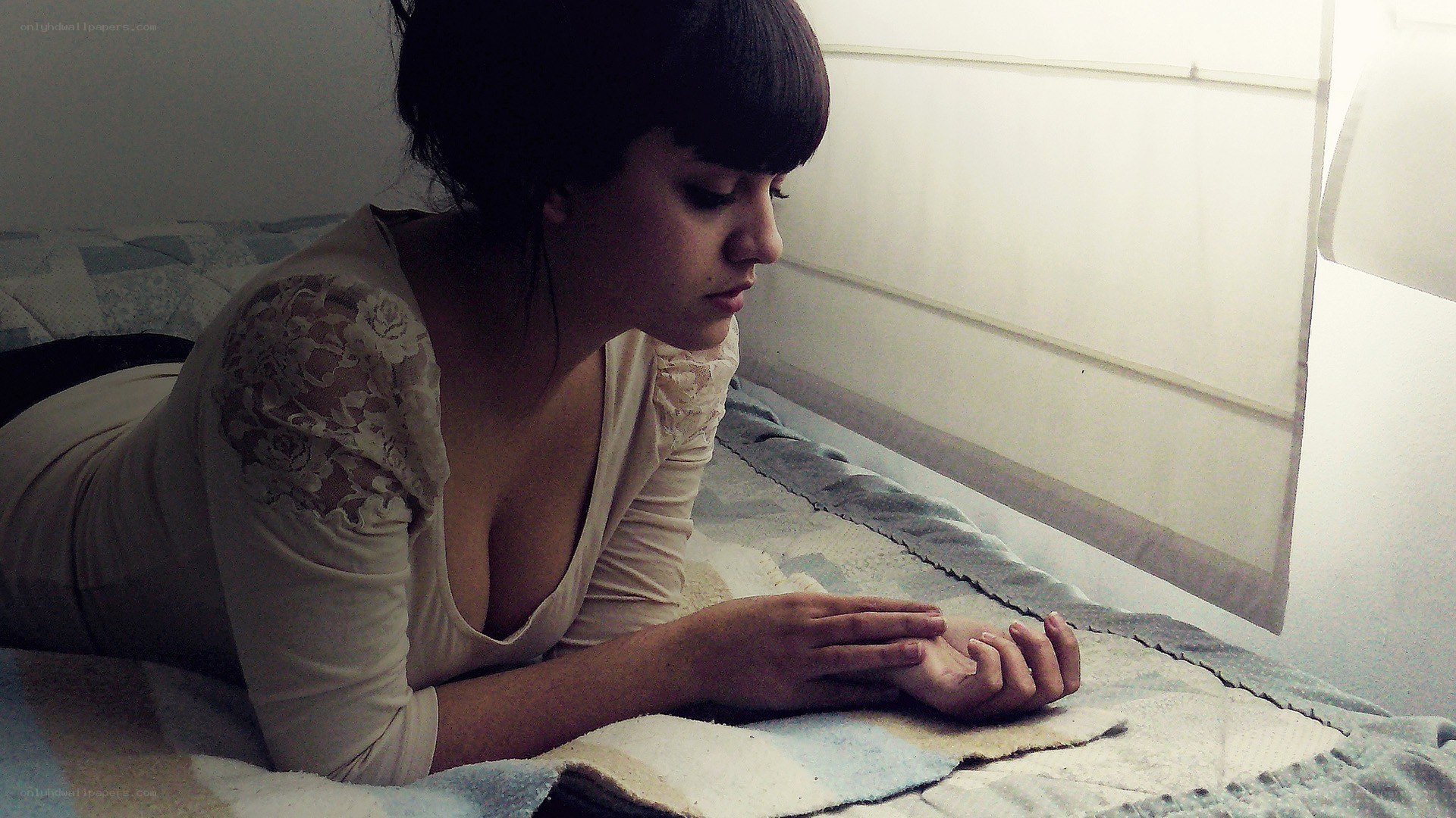 woman lying on bed