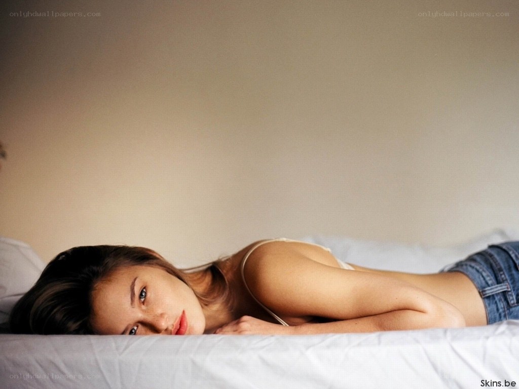 woman lying on bed