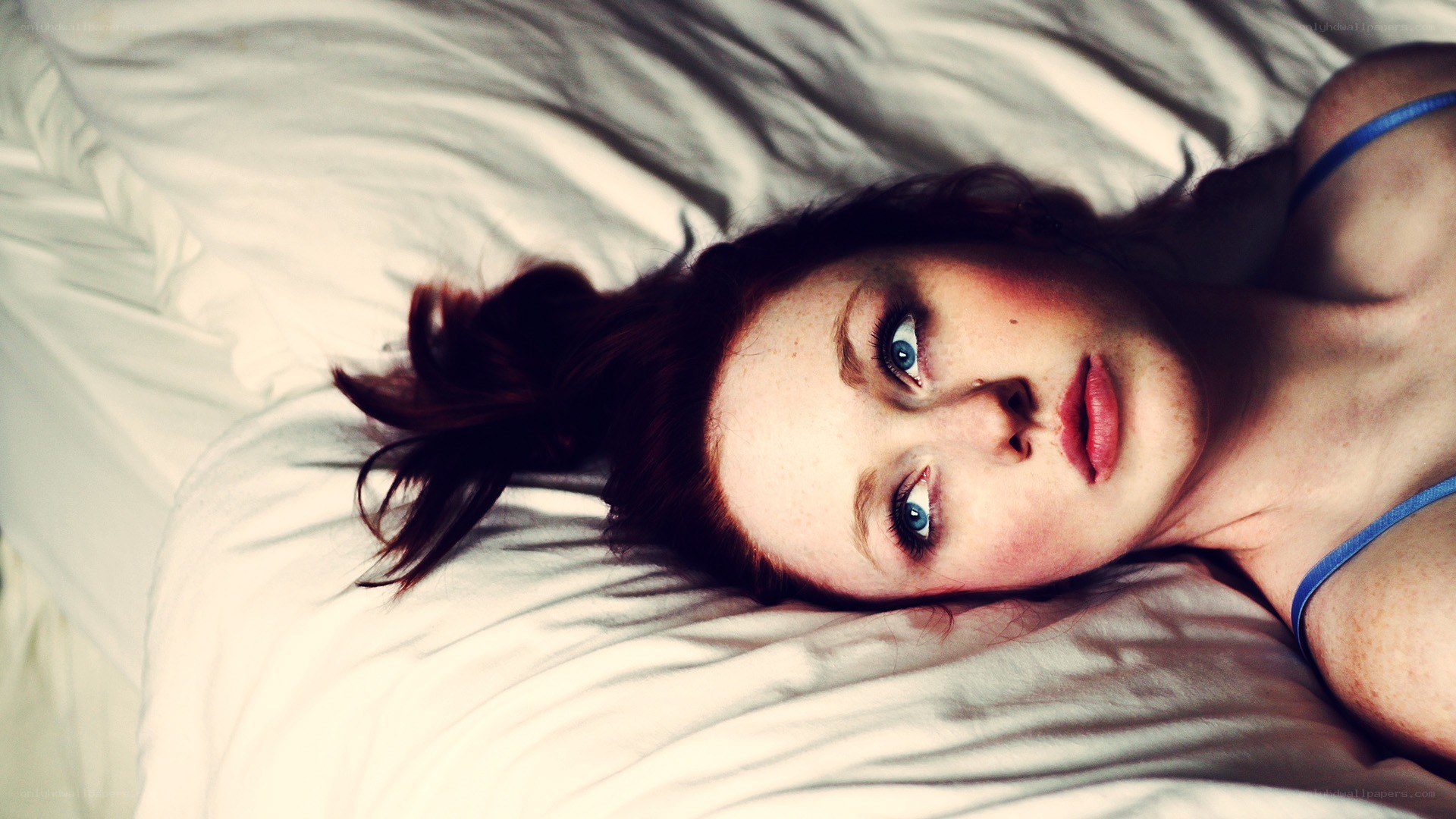 woman lying on bed