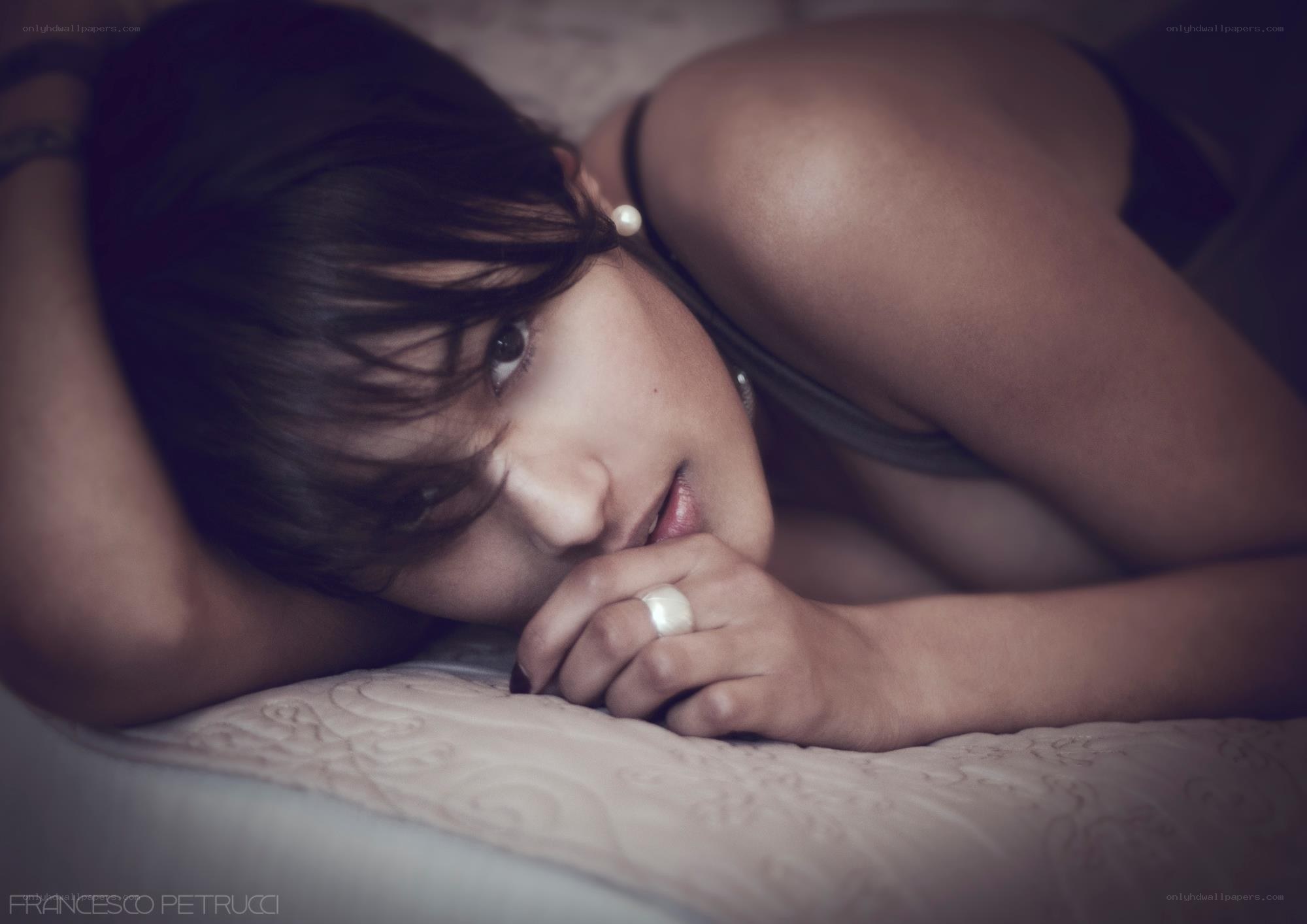 woman lying on bed