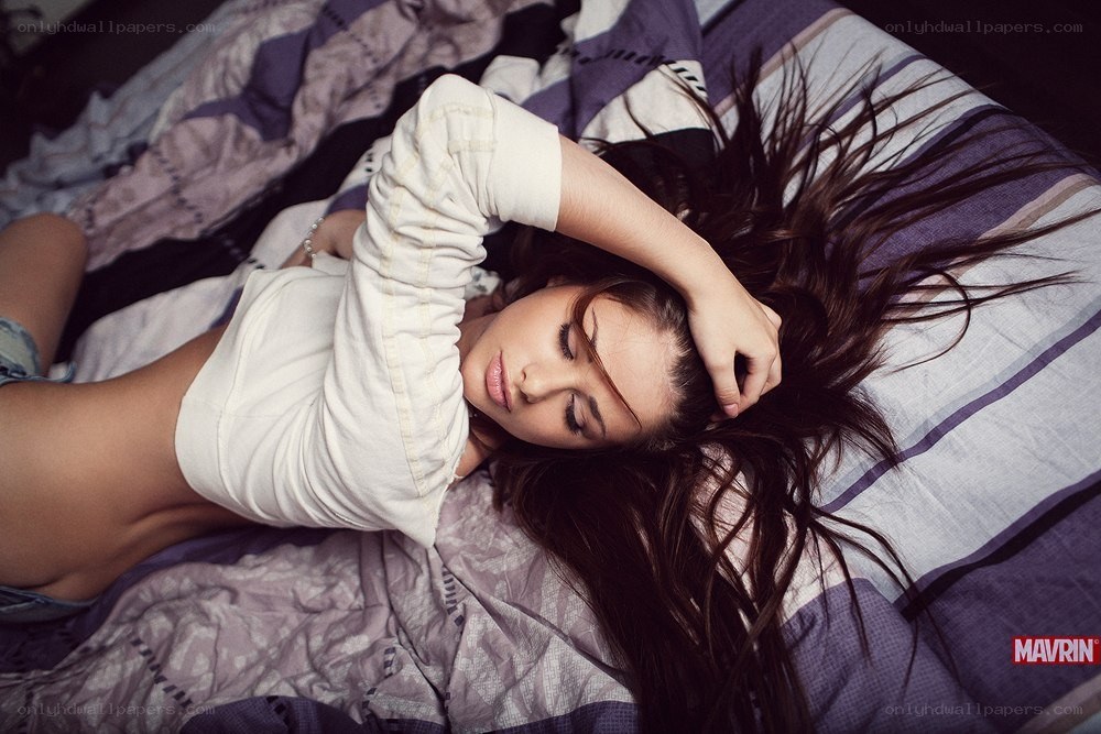 woman lying on bed