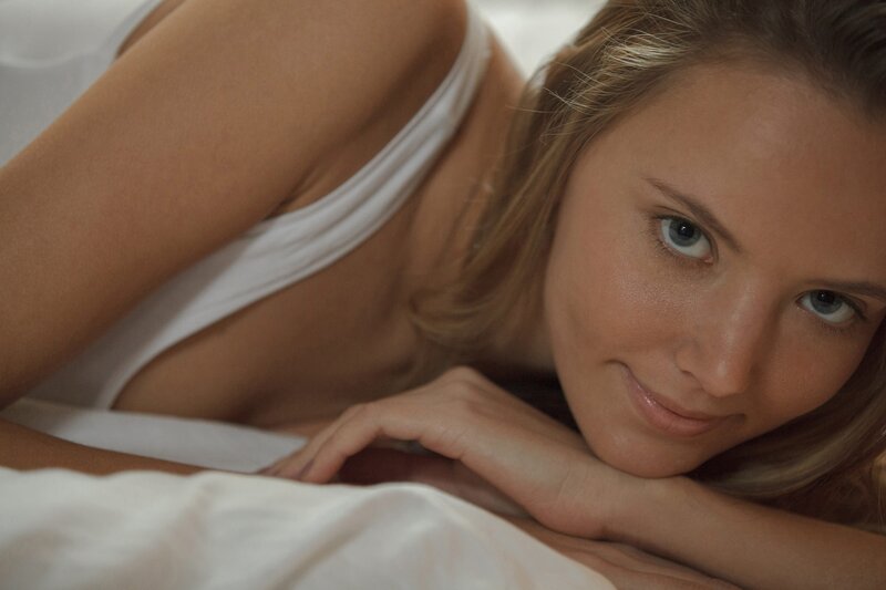 woman lying on bed