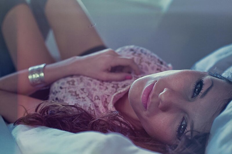 woman lying on bed