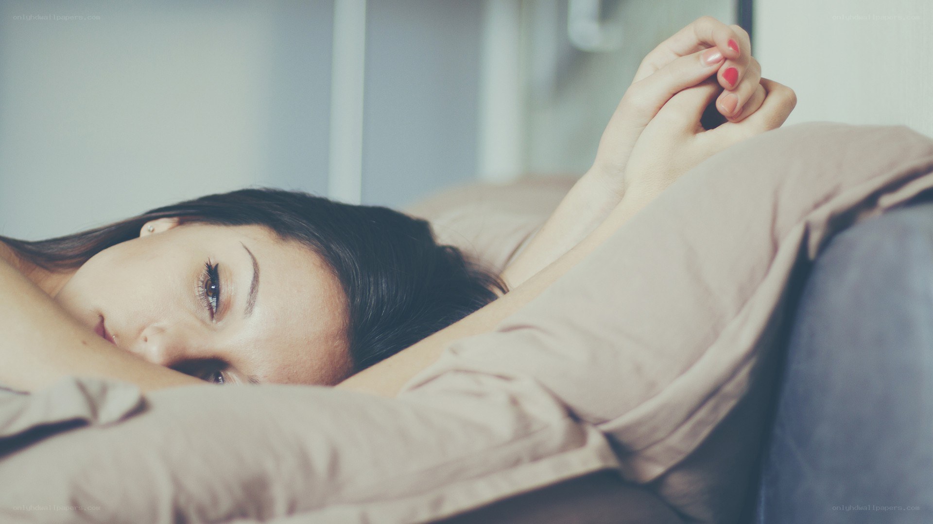 woman lying on bed