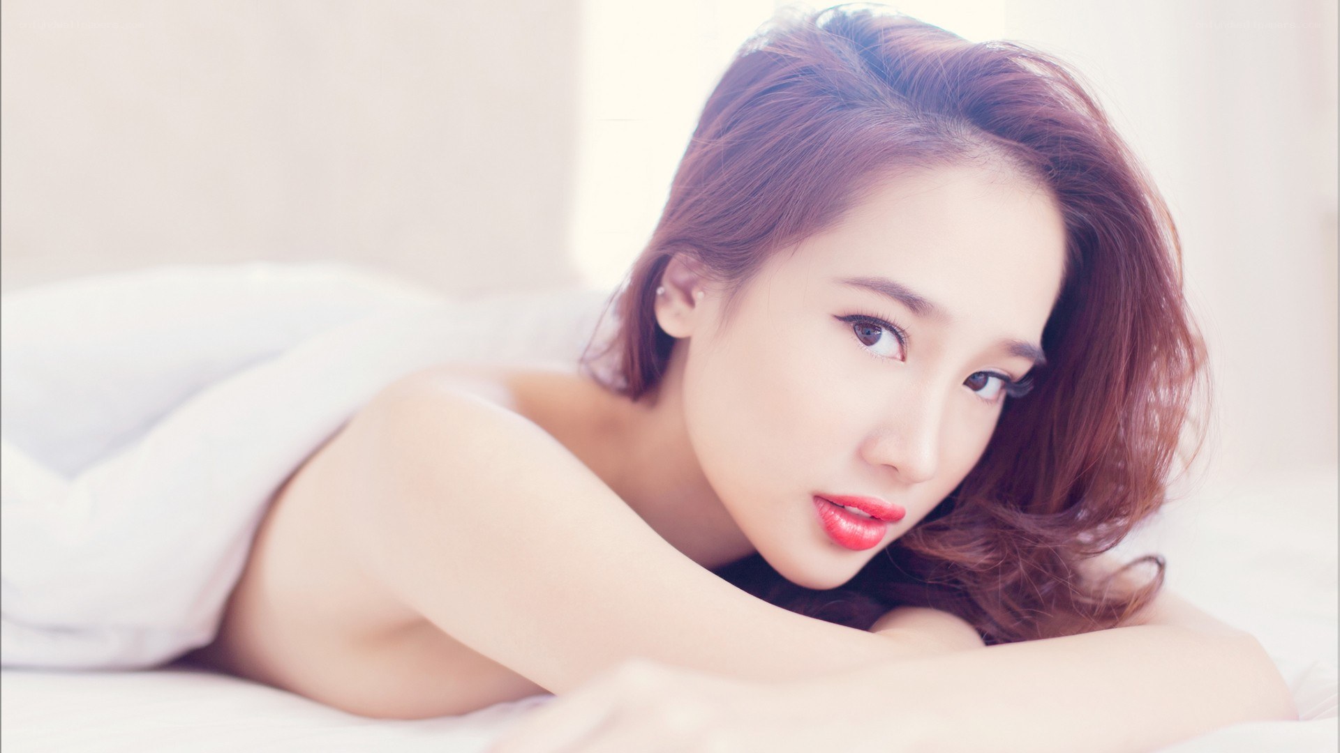 woman lying on bed
