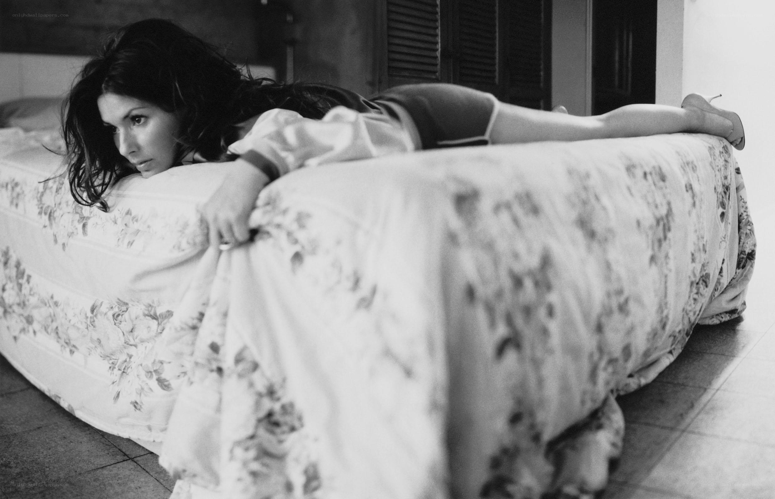 woman lying on bed