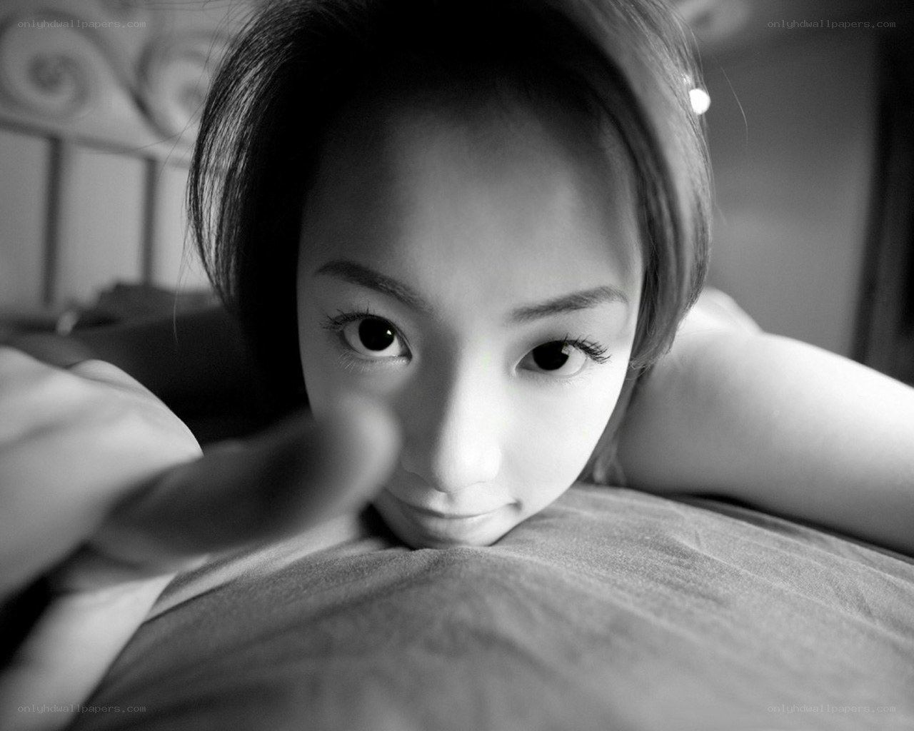 woman lying on bed