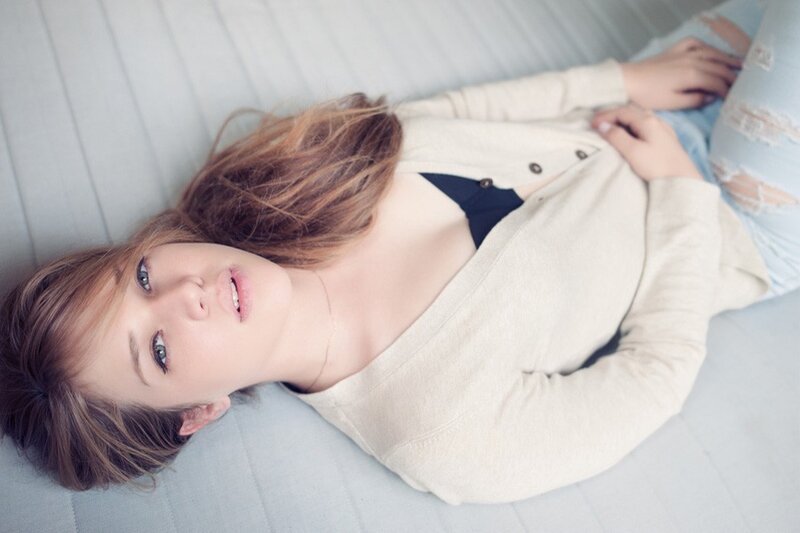 Woman Lying on Bed — Beige, Relaxed, Photograph, Cardigan