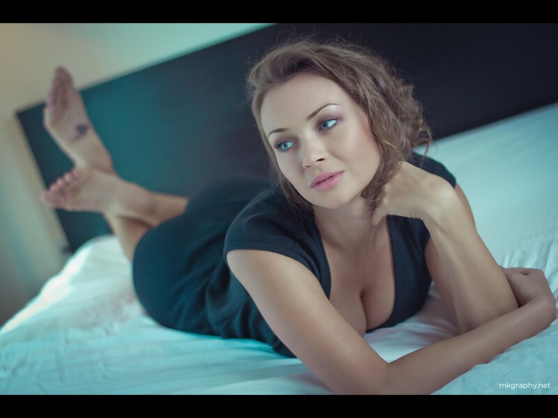 Woman Lying on Bed — Black, Calm, Photograph, Pillow, Foot Tattoo