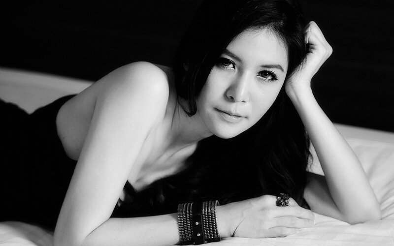 Woman Lying on Bed — Black, Dramatic, Photograph, Bracelet