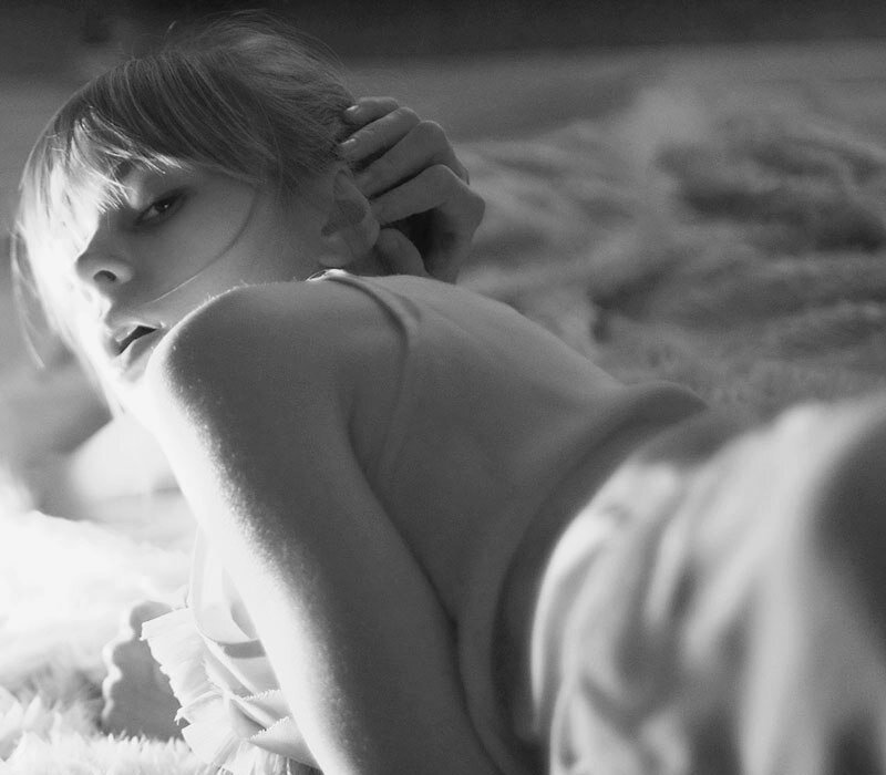 Woman Lying on Bed — Black, Intimate, Photograph
