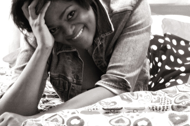 Woman Lying on Bed — Black, Relaxed, Morning, Photograph, Denim Jacket