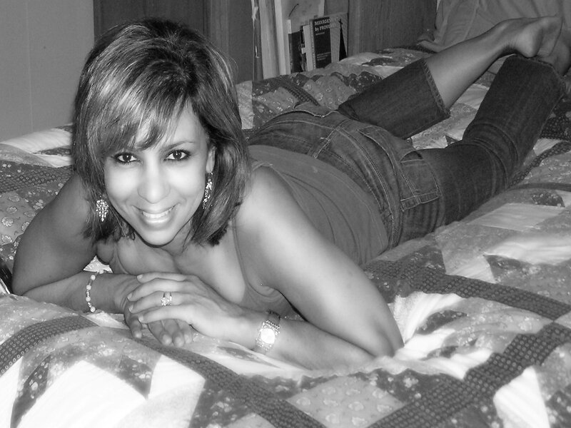 Woman Lying on Bed — Black, Relaxed, Photograph, Jeans, Ring