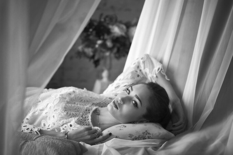 Woman Lying on Bed — Black, Serene, Photograph, Pillow