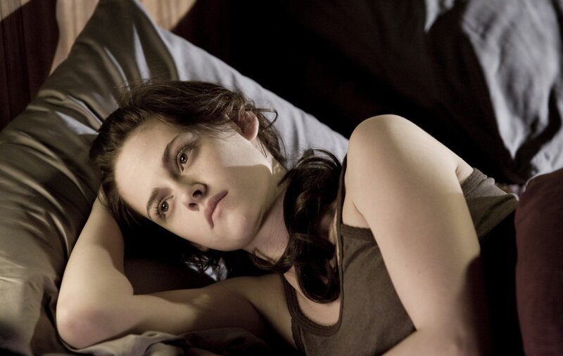 Woman Lying on Bed — Brown, Contemplative