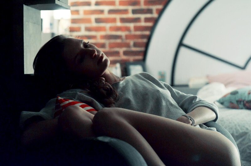 Woman Lying on Bed — Gray, Contemplative