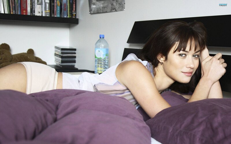 woman lying on bed in bedroom