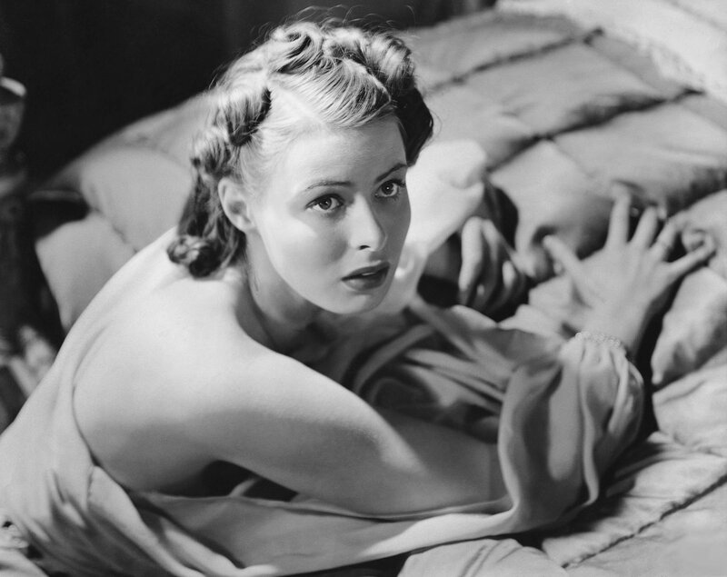 Woman lying on bed in black and white