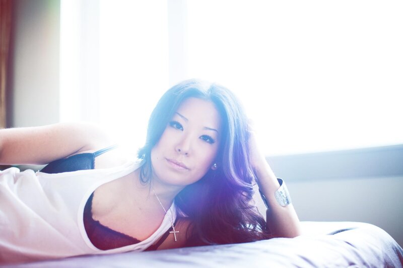 woman lying on bed in sunlight