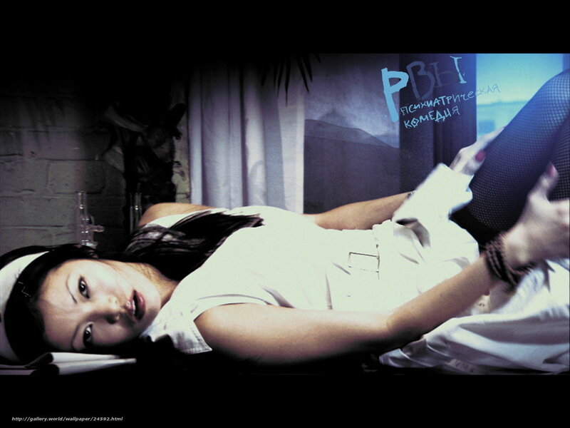 woman lying on bed in white shirt