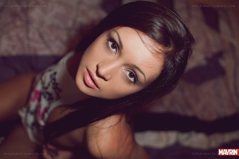woman lying on bed looking up
