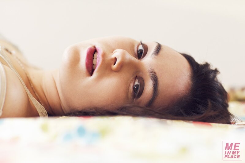 woman lying on bed looking up